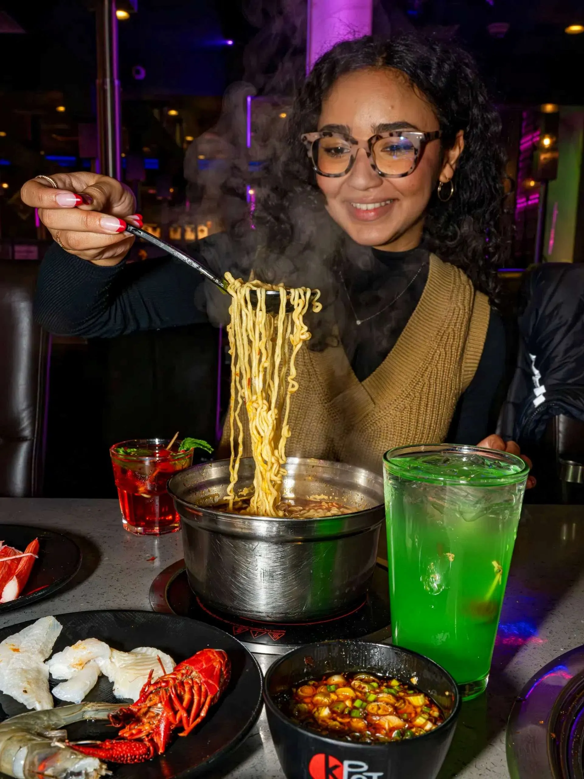 Guest enjoying Hot Pot noodles