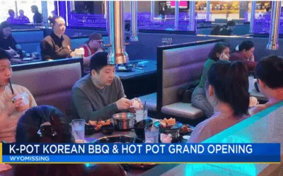 TV news segment: K-Pot Korean BBQ & Hot Pot grand opening in Wyomissing, with diners at a KPOT table